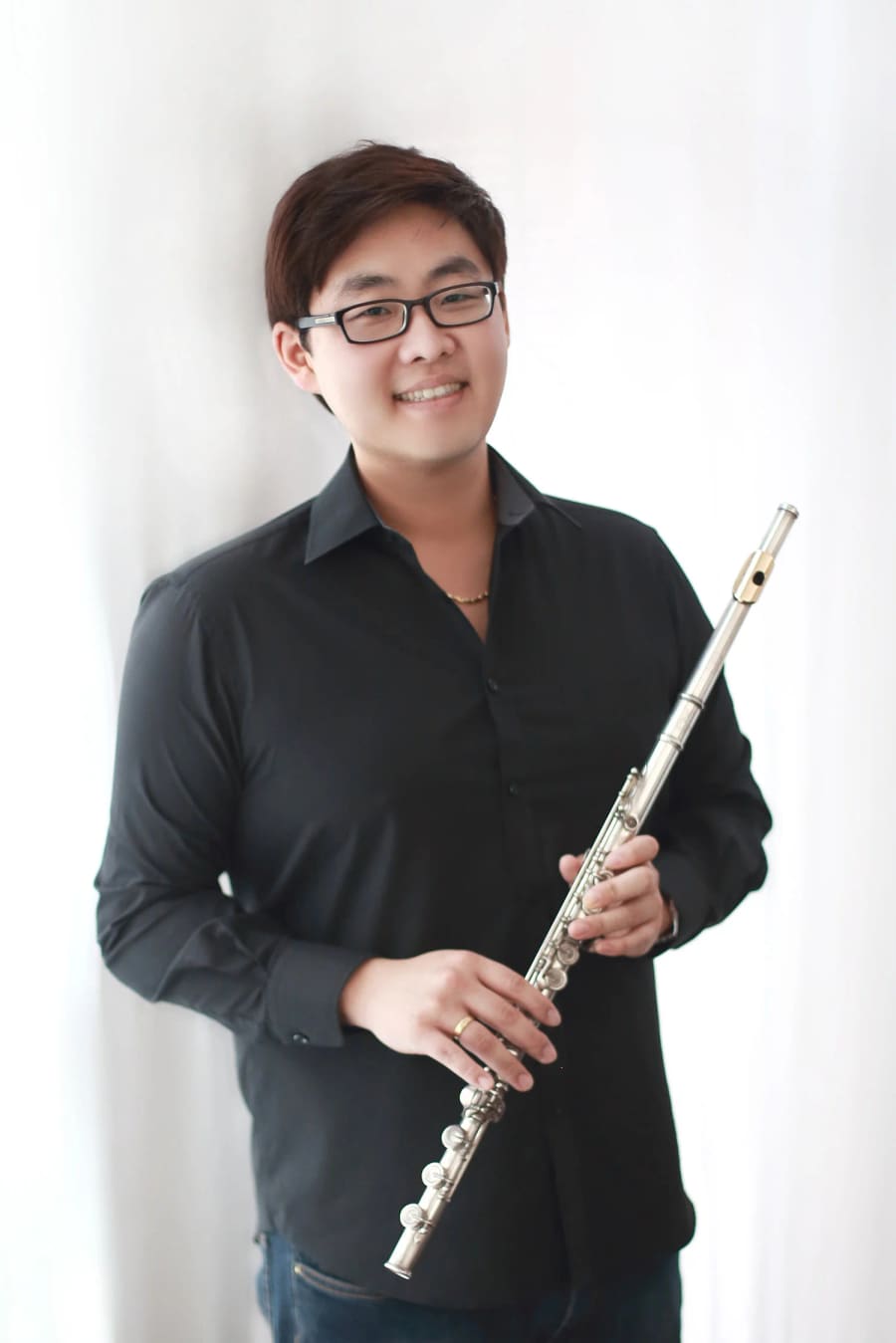 Daniel Lee holding his flute